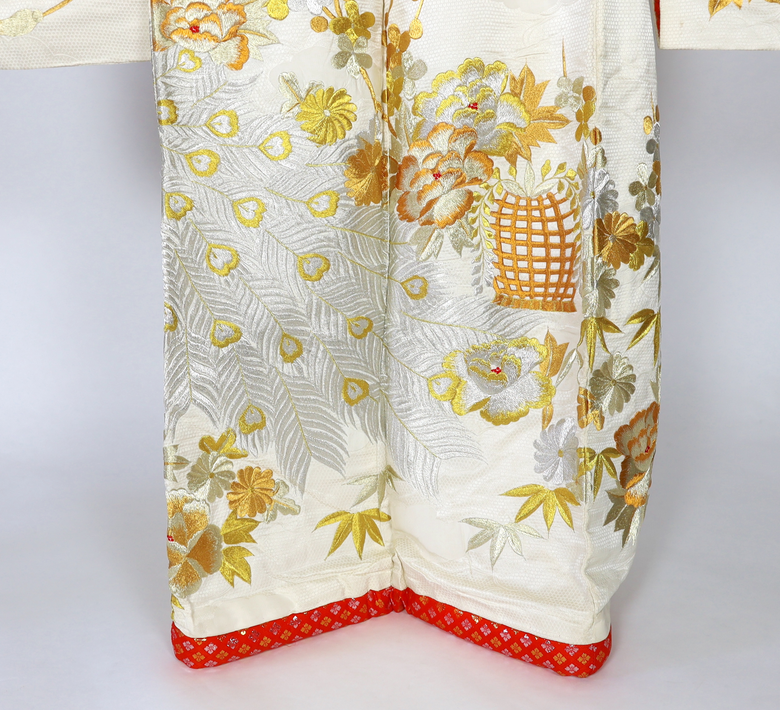 A 1960s-70s vintage Japanese embroidered wedding kimono, embroidered with pewter, bronze, silver and gold coloured metallic threads, into a large decorative design of peacocks with fanned tail feathers and trailing flowe